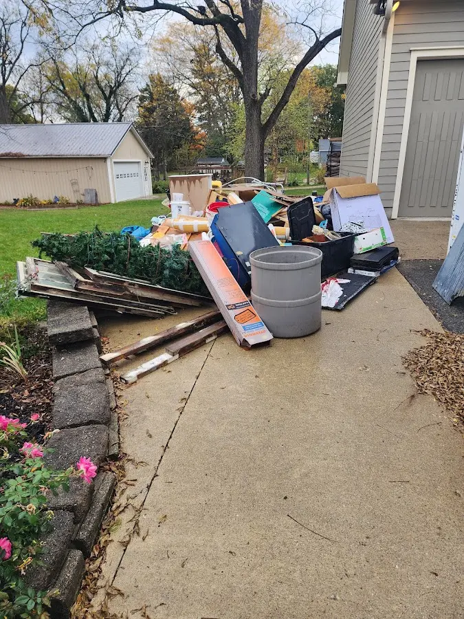 Dumpster being loaded with debris for 3 Yard Dumpster Rental in Mingo Junction